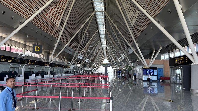 Siem Reap International airport passenger terminal it is a huge space with 30 check-in desks and about 20 people