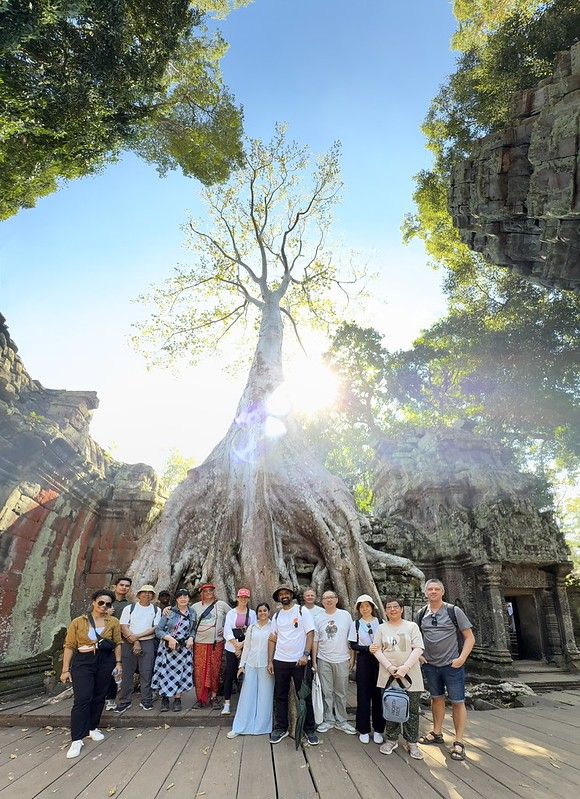 Our tour group stood infront of a huge tree that is growing out of the temple stones